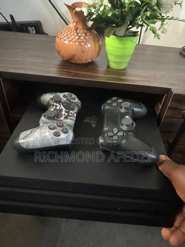 PlayStation 4 Pro 500GB with 2 Controllers & 3 Games - 1
