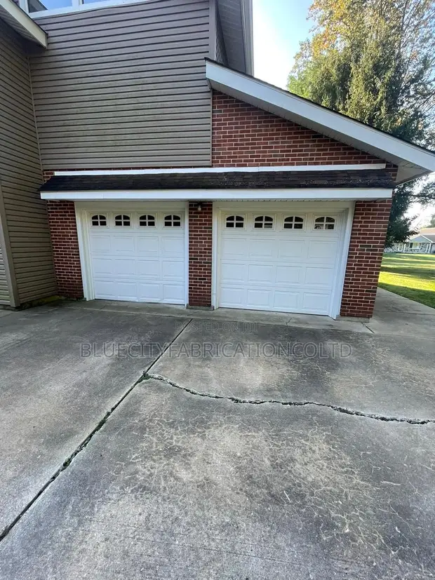 Brand New Garage Door with Small Windows - 1