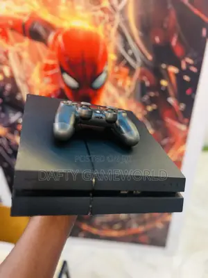 PS4 Fat Console with 2 Controllers and Loaded Games