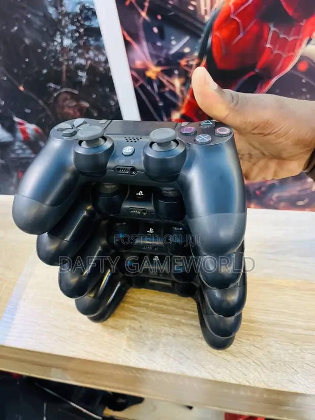 Used PS4 Fat Console with Games and 2 Controllers - 1
