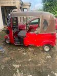 Bajaj RE 2026 Red - 1