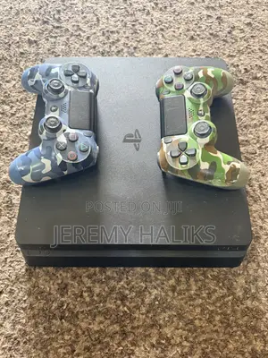 PlayStation 4 Slim with 5 Games and 2 Controllers