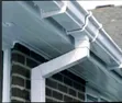 White PVC Rain Gutter and Black Accessories - 1