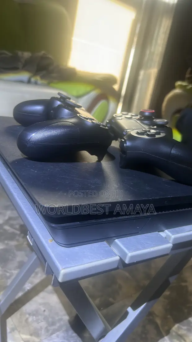 PS4 Slim Black with 2 Controllers & 11 Games - 1