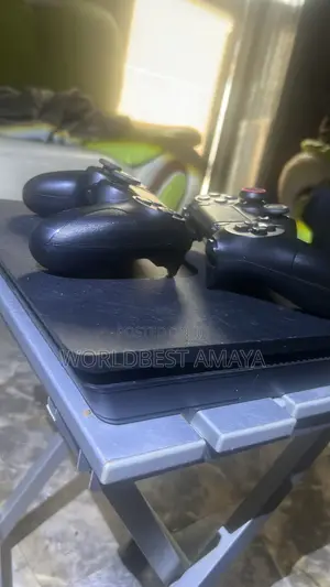 PS4 Slim Black with 2 Controllers & 11 Games