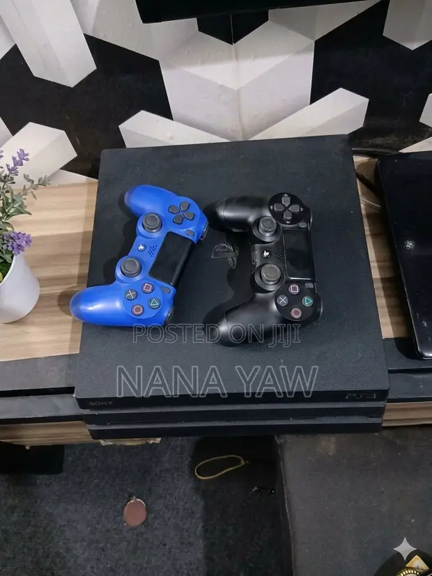 PS4 Pro with Two Original Controllers - 1