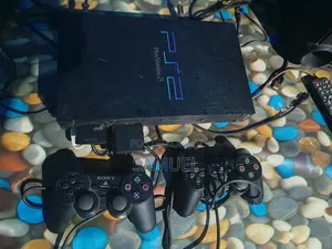 PlayStation 2 with 8 Games and 2 Controllers