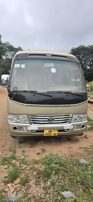 Toyota Coaster Bus 2016 - Gold