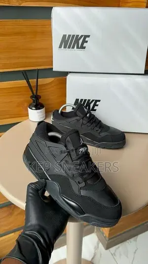 Nike Air Jordan 4 RM "Black Cat" Sneakers