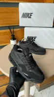 Nike Air Jordan 4 RM "Black Cat" Sneakers - 1