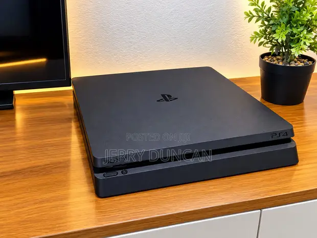PlayStation 4 Slim with 5 Games & 1 Controller - 1