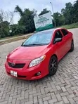 2010 Toyota Corolla LE Sedan - Red - 1