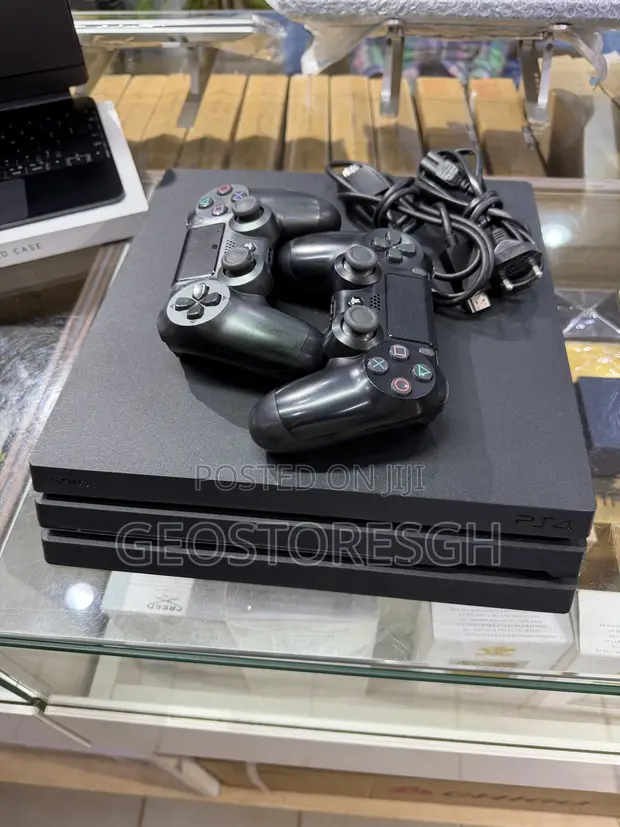 PS4 Pro 1TB with 2 Controllers & 2 Games - 1