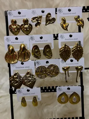 Fashionable Gold-Colored Earrings and Chains
