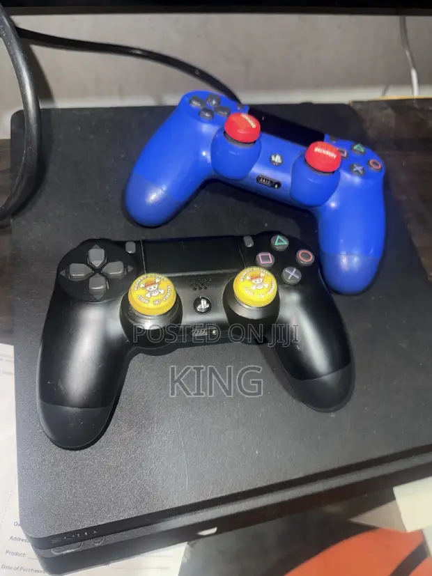 PS4 Slim 1TB Console with 2 Controllers & 5 Games - 1