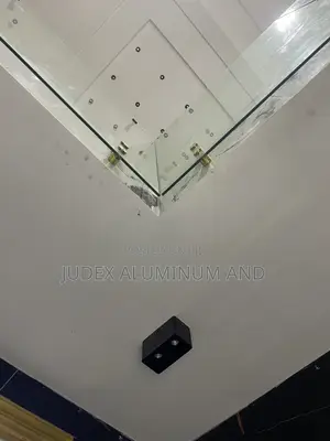 Staircase Bending Glass with Gold Bolts & Black Handrails