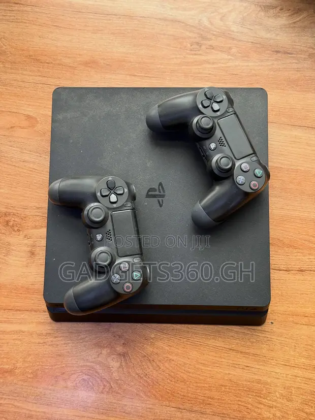 Sony PlayStation 4 Slim (1TB + 2 Controllers) - 1