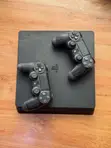 Sony PlayStation 4 Slim (1TB + 2 Controllers) - 1