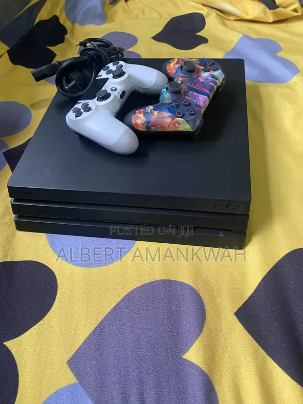 PS4 Pro 1TB with 2 Controllers and 8 Games - 1