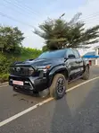 2025 Toyota Tacoma Black - 1