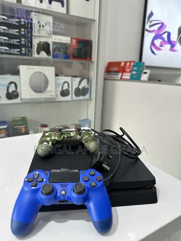 PlayStation 4 Slim with 8 Games & 2 Controllers - 1
