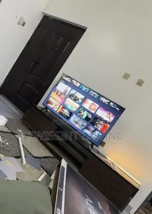 Brand New 50-inch Smart TV and Wooden Stand