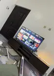 Brand New 50-inch Smart TV and Wooden Stand - 1