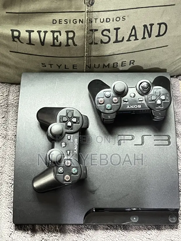 PlayStation 3 Slim with 2 Controllers & 8 Games - 1