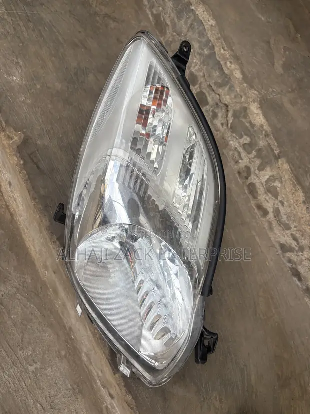 Toyota Vitz 2010 Headlight with Booster - 1