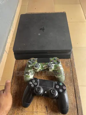 PS4 Slim Console with 2 Controllers and 4 Games