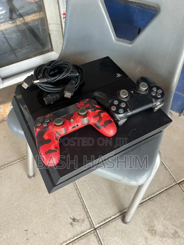 Sony PlayStation 4 with Games & 2 Controllers - 1