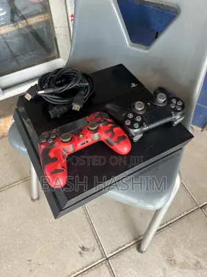 Sony PlayStation 4 with Games & 2 Controllers