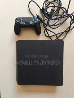 PlayStation 4 with 2 Controllers and 4 Games