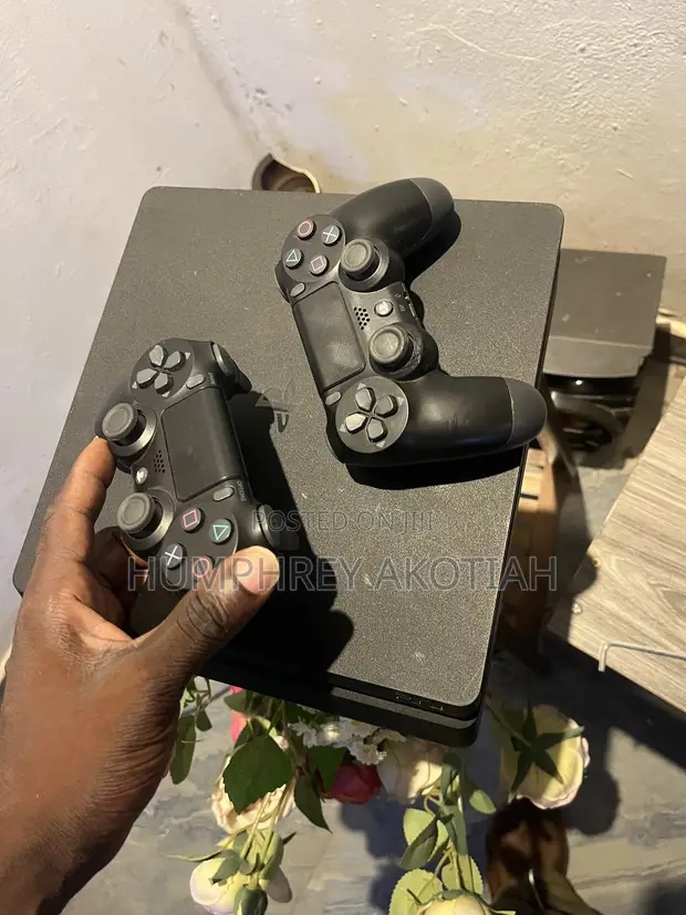 PlayStation 4 Slim with 2 Controllers & Games - 1