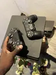 PlayStation 4 Slim with 2 Controllers & Games - 1