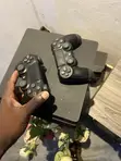 PlayStation 4 Slim with 2 Controllers & Games - 2