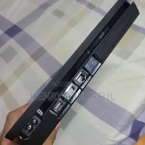 PS4 Slim Console with Games & 2 Controllers