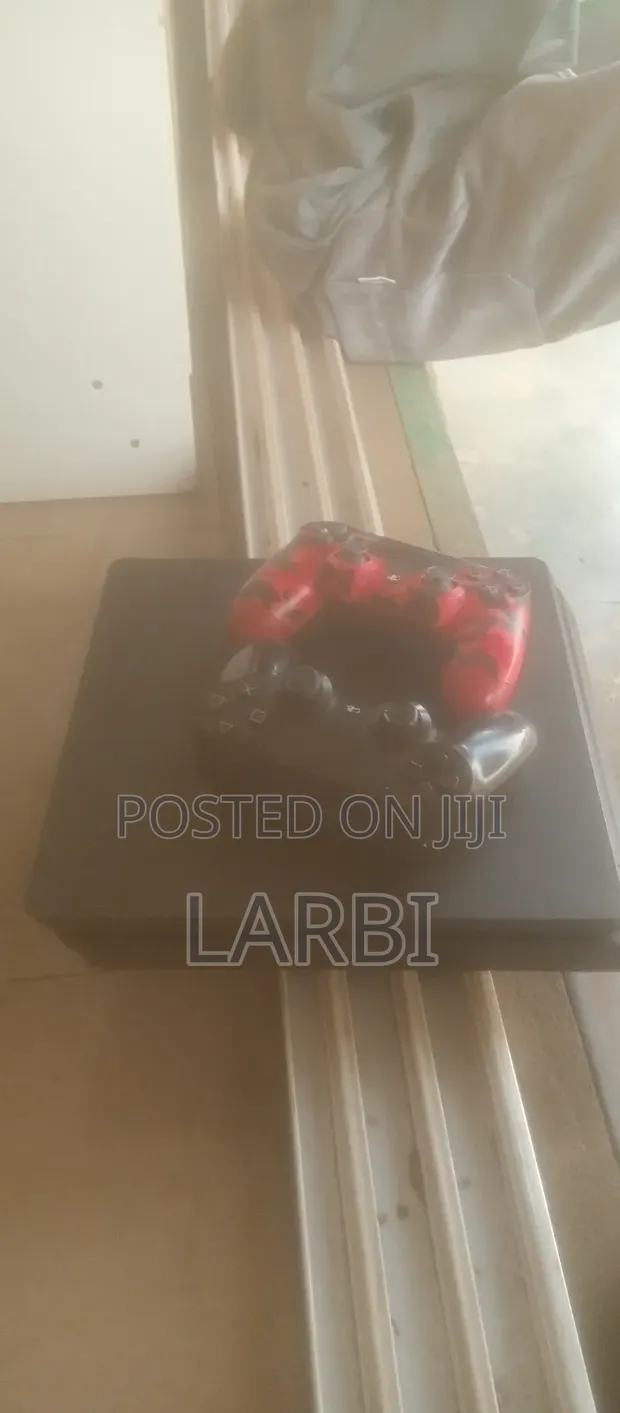 PS4 Slim Console with Games & Controllers - 1