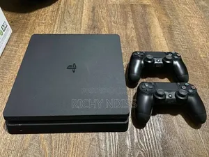 PS4 Slim 1TB with 2 Controllers & 8 Games (Jailbroken)