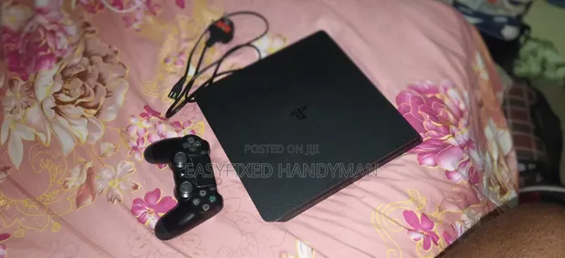 PS4 Slim Console with 2 Controllers & 4 Games - 1