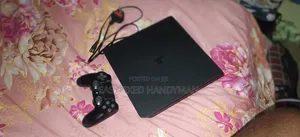 PS4 Slim Console with 2 Controllers & 4 Games