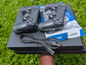 PS4 Console with 2 Controllers and 8 Games